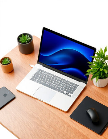 Laptop and office supplies on wooden desk isolated on white background.