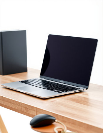 Laptop on wooden table with blank screen for your text or design