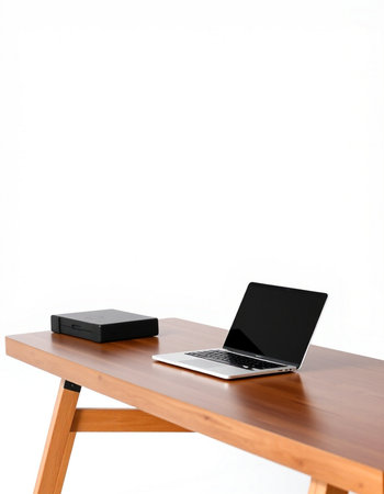 Laptop on wood table isolated on white background with clipping path.