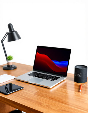 laptop on wood desk with speaker and smart phone on white background
