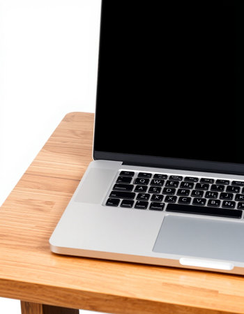 Laptop computer on wooden table isolated on white background with clipping path