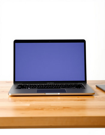 Laptop with blank screen on a wooden table isolated on white background