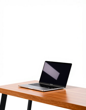 Laptop on wooden table isolated on white background with clipping path.