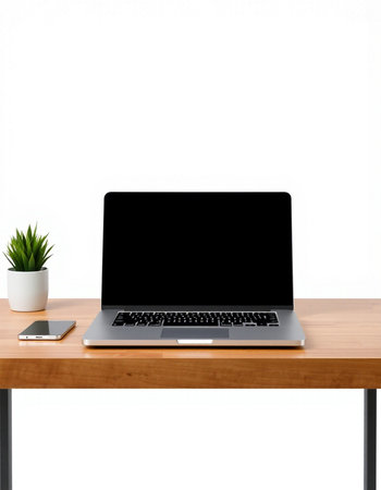 Laptop computer with blank screen on wooden table isolated on white background