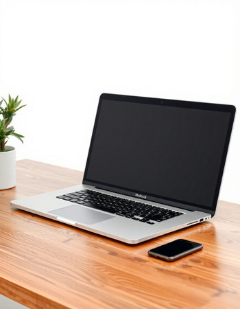 Laptop on a wooden table.