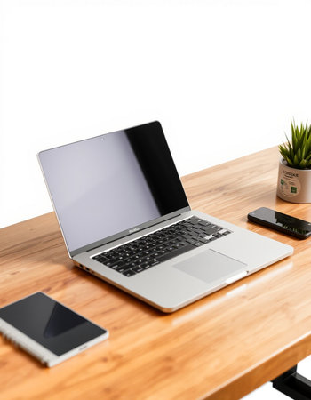 Laptop computer on wooden desk isolated on white background with clipping path