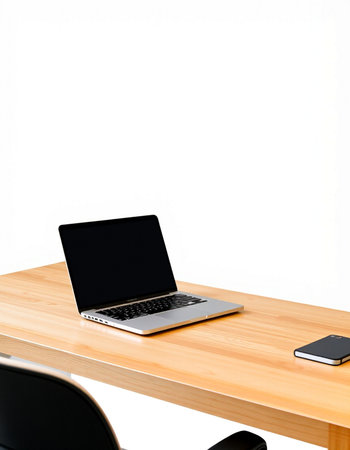 Laptop and smartphone on the wooden desk with white wall background.