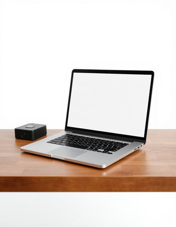 Laptop with blank screen on a wooden table isolated on white background