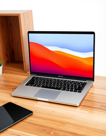 Laptop on wooden table.