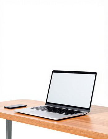 Laptop with blank screen on wooden desk isolated on white background.