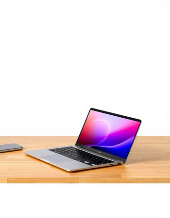 Laptop on wooden table isolated on white background with clipping path.