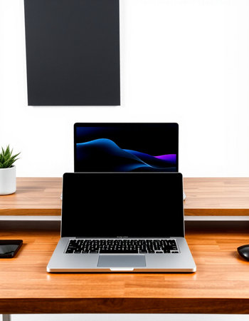 Laptop with blank screen on wooden table in office, stock photo