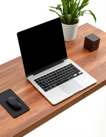 Laptop computer and mouse on a wooden desk isolated on white background