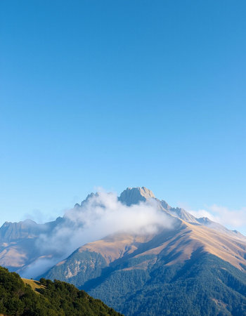 Mountain landscape with blue sky and clouds.