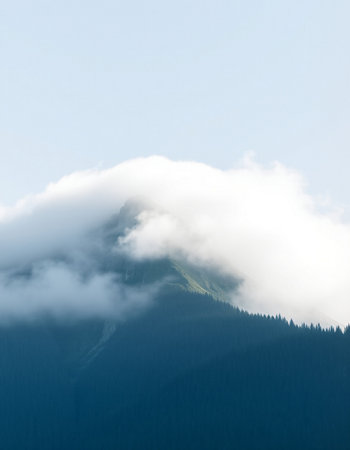 Mountains in the clouds. Alaska. USA. Blue sky.の写真素材