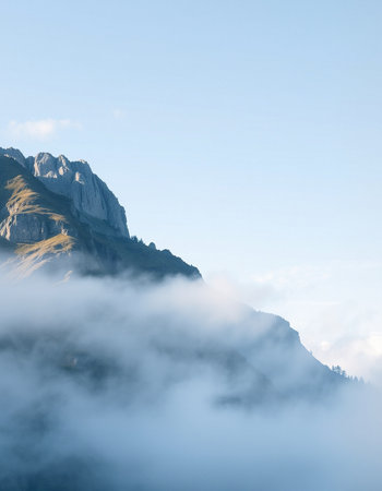 Mountain landscape with fog and clouds.の写真素材