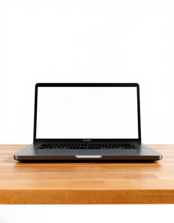 Laptop with blank screen on wooden table against white background. Mock upの写真素材