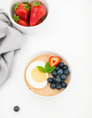 Healthy breakfast with berries on a white background