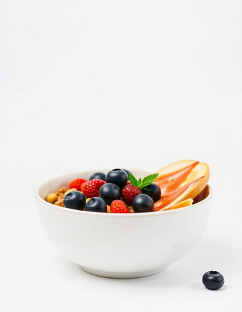 bowl of fresh fruits and berries isolated on white background, healthy foodの写真素材