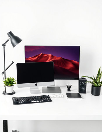 Modern workspace with computer monitor, keyboard, mouse, screen and accessories.