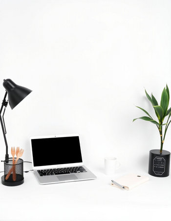 Workplace with laptop, coffee cup and plant on white background.の写真素材