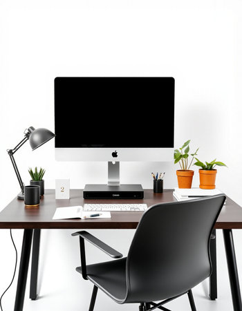 Modern workplace with computer on table and black chair on white wall background
