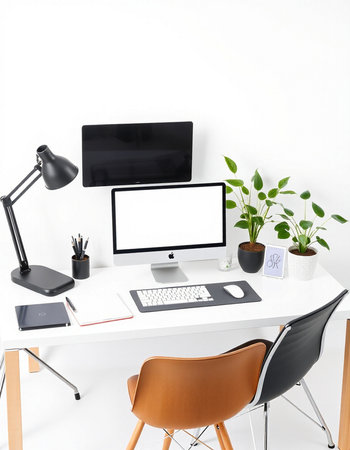 Minimalistic workspace with computer, tablet and other items on white background