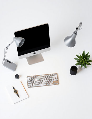 Workplace with computer, keyboard, mouse, lamp and coffee cupの写真素材