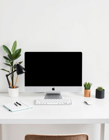 Modern workplace with blank computer monitor, stationery and decorations. Mockup