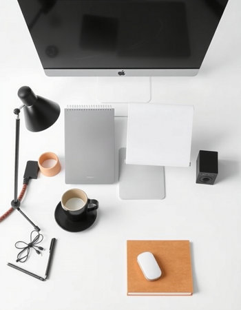 Designer workspace with computer and stationery on white background. Flat lay, top view