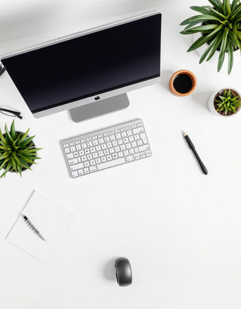 White office desk table with computer, keyboard, notepad and coffee cup. Top view, flat lay