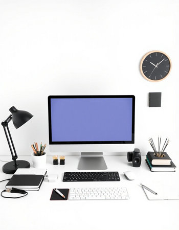 Modern workspace with blank screen computer, stationery and clock on white background
