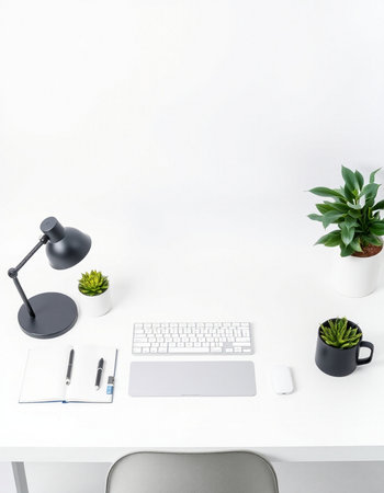 Top view of modern office workplace with keyboard, smartphone, stationery and plant. Mock up