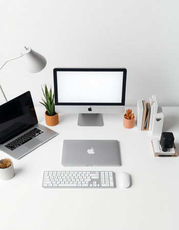workplace with computer, keyboard, mouse, lamp and stationeryの写真素材