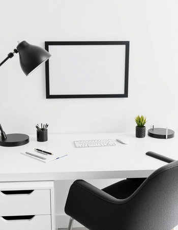 Comfortable workplace with blank picture frame on white wall, closeup