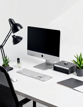 workplace with computer, keyboard, mouse, lamp, notebook and plantの写真素材