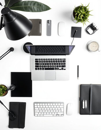 White office desk table with laptop, smartphone, notebook, stationery and coffee cup. Top view, flat layの写真素材
