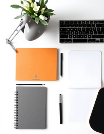 Flat lay, top view office desk table with laptop, smartphone, supplies and flowersの写真素材