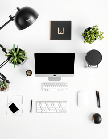 White office desk table with computer, supplies and decorations. Flat lay, top view