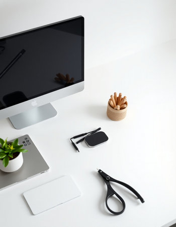 White office desk table with computer, supplies and coffee cup. Top view