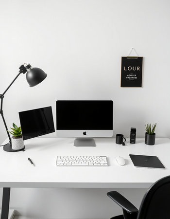 Modern workplace with computer, keyboard, mouse, lamp and stationery
