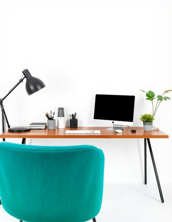 workplace with computer, chair and lamp on the white wall background