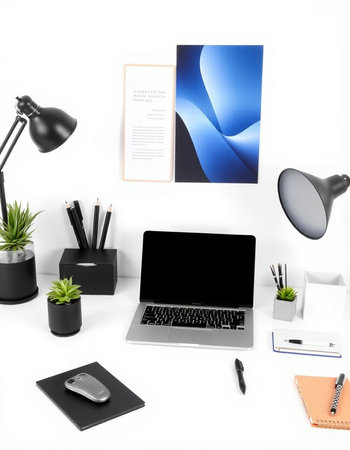 Modern workspace with blank screen laptop, stationery and decorations on white background. 3D rendering.の写真素材
