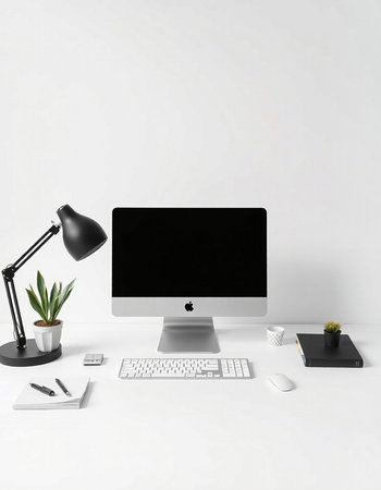 Modern workspace with blank computer monitor, keyboard, mouse, lamp and office supplies on white...