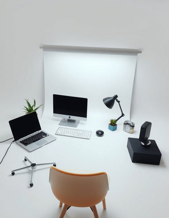 Workplace with a computer and a lamp on a white background.