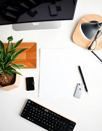 White office desk table with computer, supplies and coffee cup. Top view with copy space, flat lay