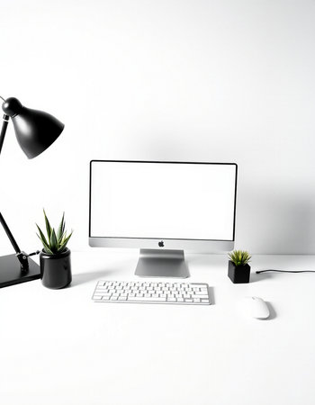 Modern workspace with computer, keyboard, mouse, lamp and plant on white background