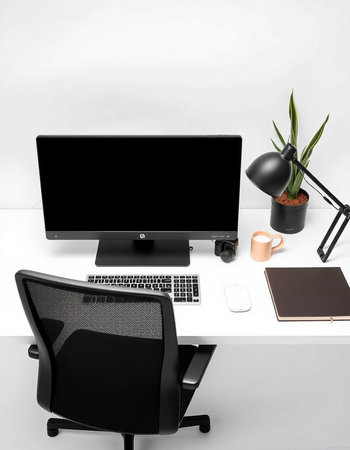 Modern workplace with computer, mouse, lamp and stationery on white table