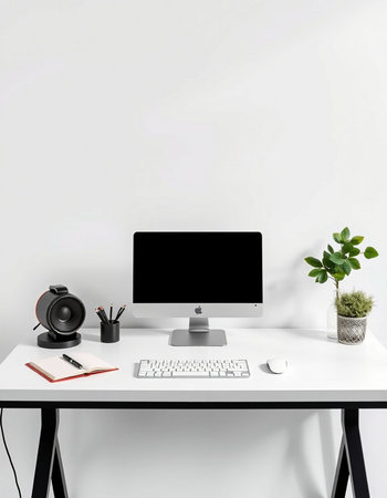 Modern workspace with computer, keyboard, mouse, notebook and decorations on white tableの写真素材