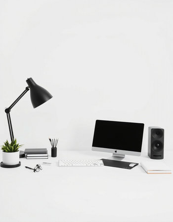 Minimalistic workspace with computer, keyboard, mouse, coffee cup and other items on white...
